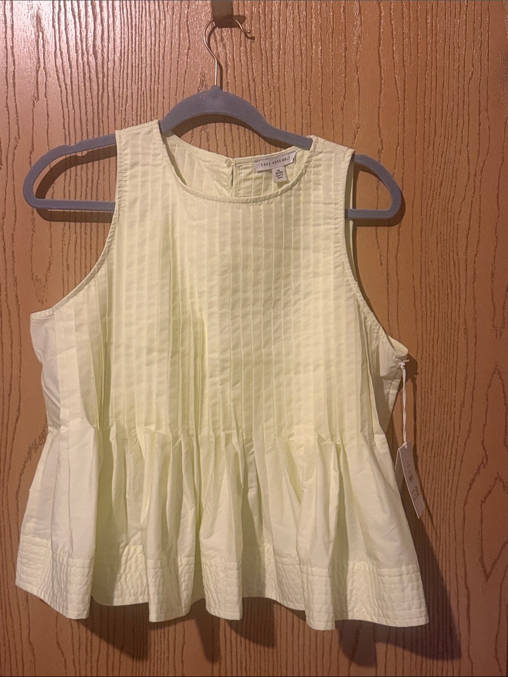 NWT Pale  Yellow Pleated Peplum Sleeveless Top